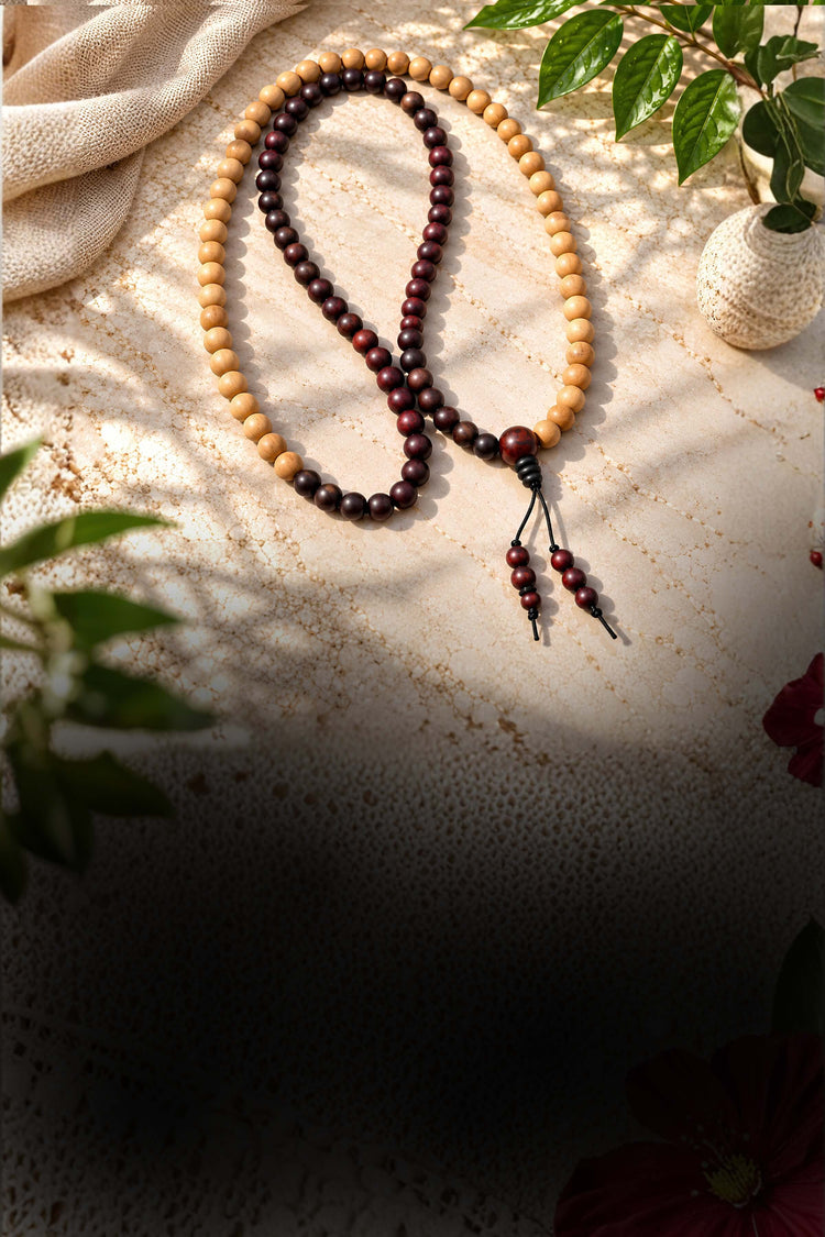 Red and white sandalwood 54-bead malas, grouped together